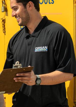 Crisan team lead with clipboard helping homeowners